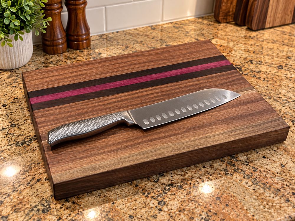 Walnut board with a purpleheart stripe and a chef's knife